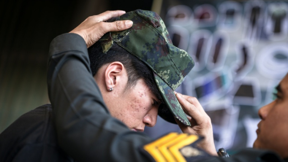 Red or black: Thai men tempt fate at military draft draw