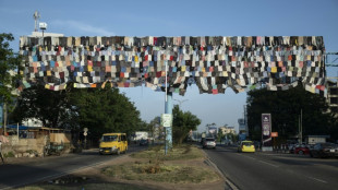 Ghana artist's billboard campaign takes aim at fast fashion fallout