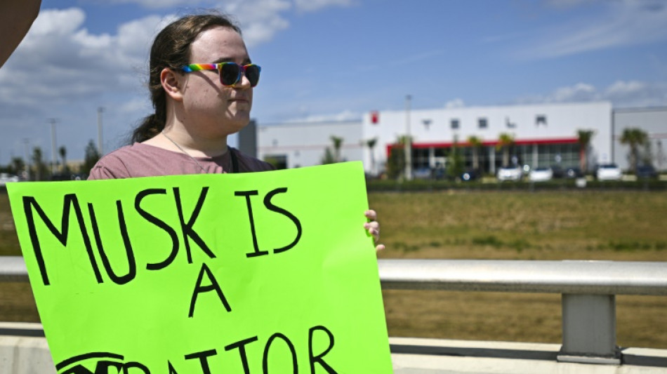 Protesters denounce Musk at Tesla dealerships in US, Europe