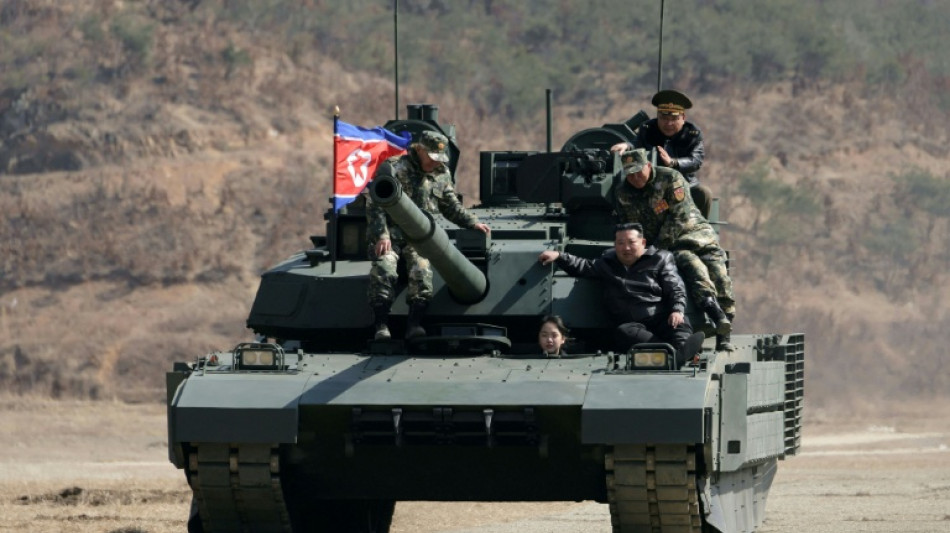 North Korean leader, daughter try out new tank