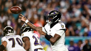Jackson throws four TD passes as Ravens rout Dolphins