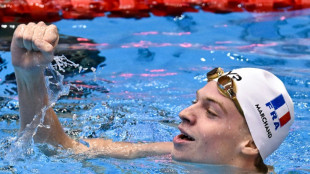 Marchand wins third gold while Australia scoop more titles